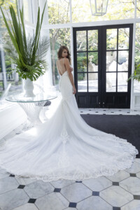A fine shoulder strap to a low V back this gown hugs the body truly romantic Designer wedding gown rental Melbourne